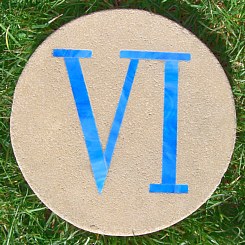 [ Roman numeral 6, in blue stained-glass ]